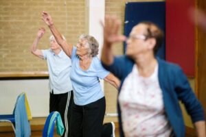 StayActive4Life class members exercising with arms raised